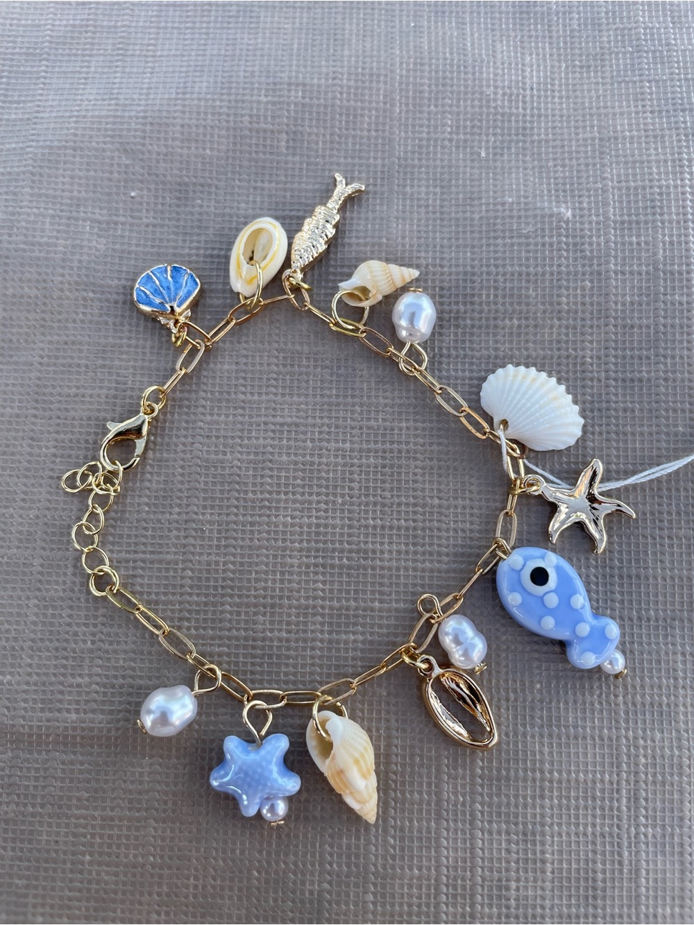 Gold-Tone Sea Charm Bracelet with Blue and Cream Accents